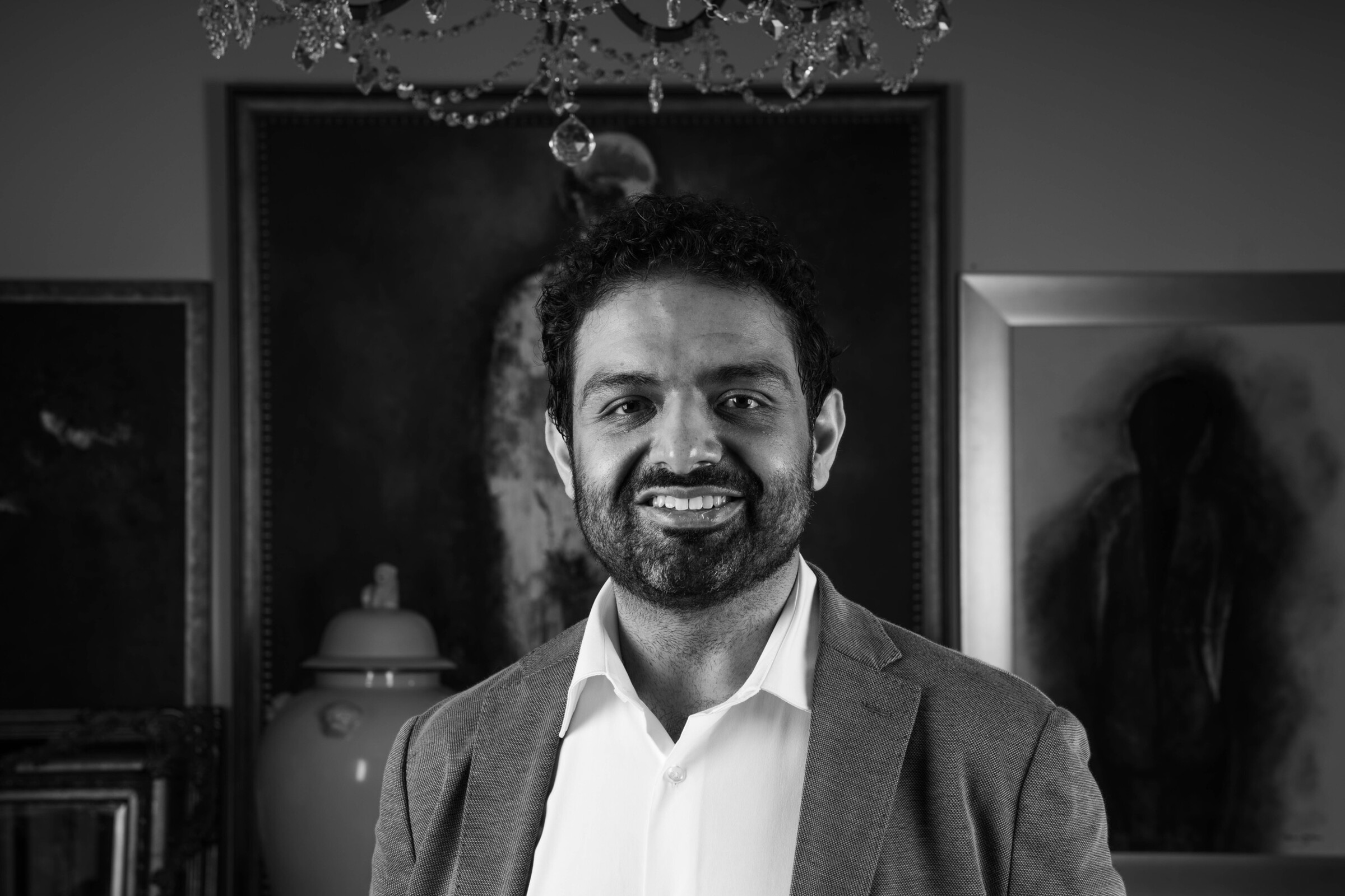 Tariq Ismail, black and white portrait, seated in the studio