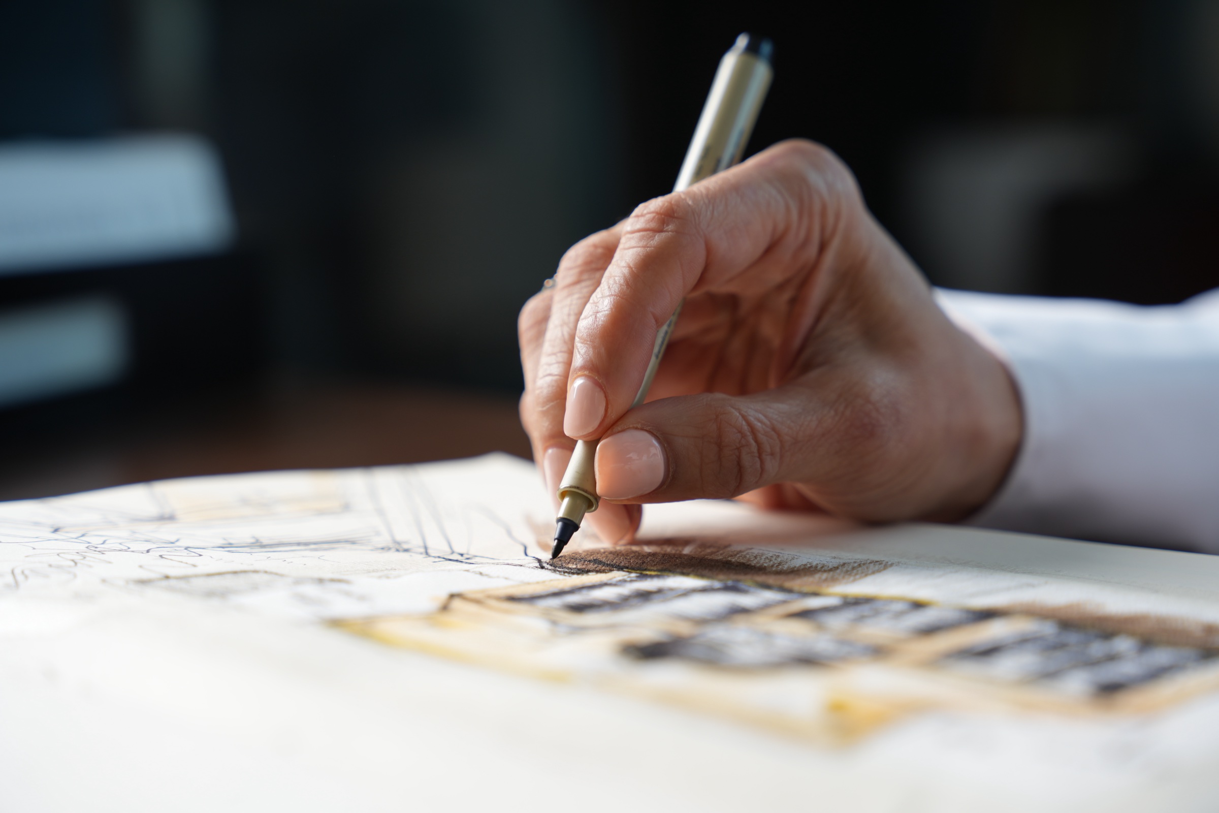 Ink and wash detail in the studio sketchbook: a design brief taking shape